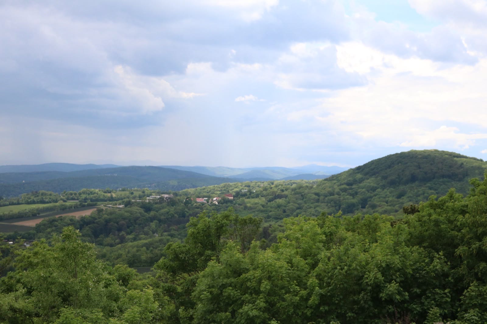 Green hills under a wide summer sky